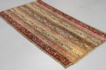 A rug, antique Gördes (Ghiordes), ca 206 x 113 cm.