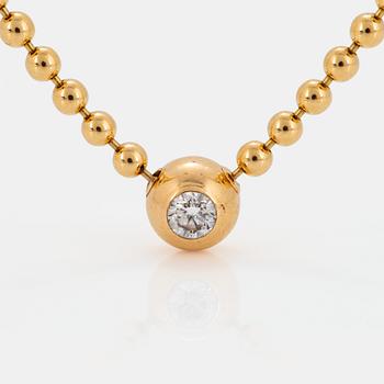 A Cartier "Pluie de Diamants" 18K gold necklace with a round brilliant-cut diamond.