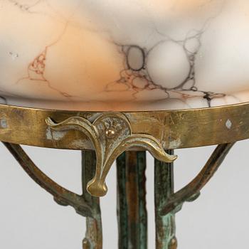 A brass and bronze Art Nouveau table lamp, early 20th century.