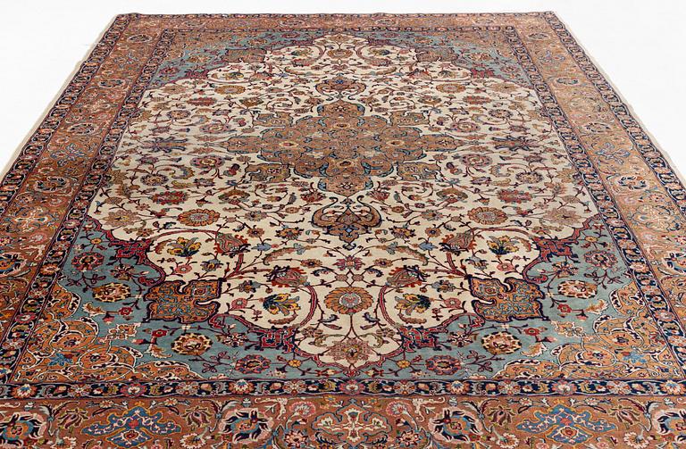 A semi-antique Tabriz carpet, 361 x 235 cm.