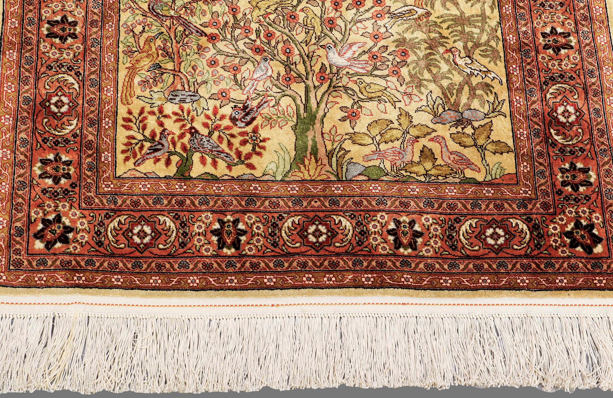 An Oriental figural silk rug, ca 126 x 83 cm.