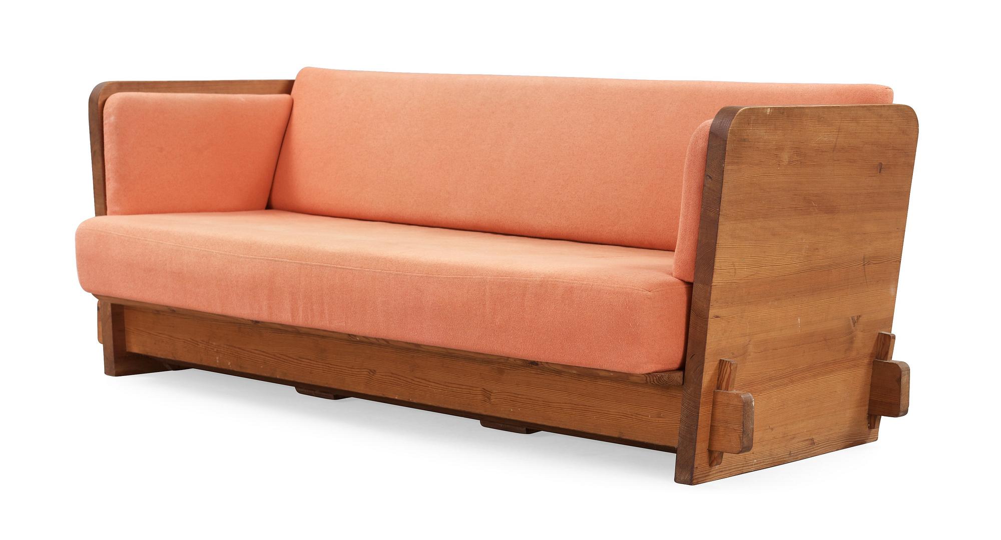 An Axel Einar Hjorth stained pine sofa 'Lovö'. Nordiska Kompaniet Sweden 1930's.