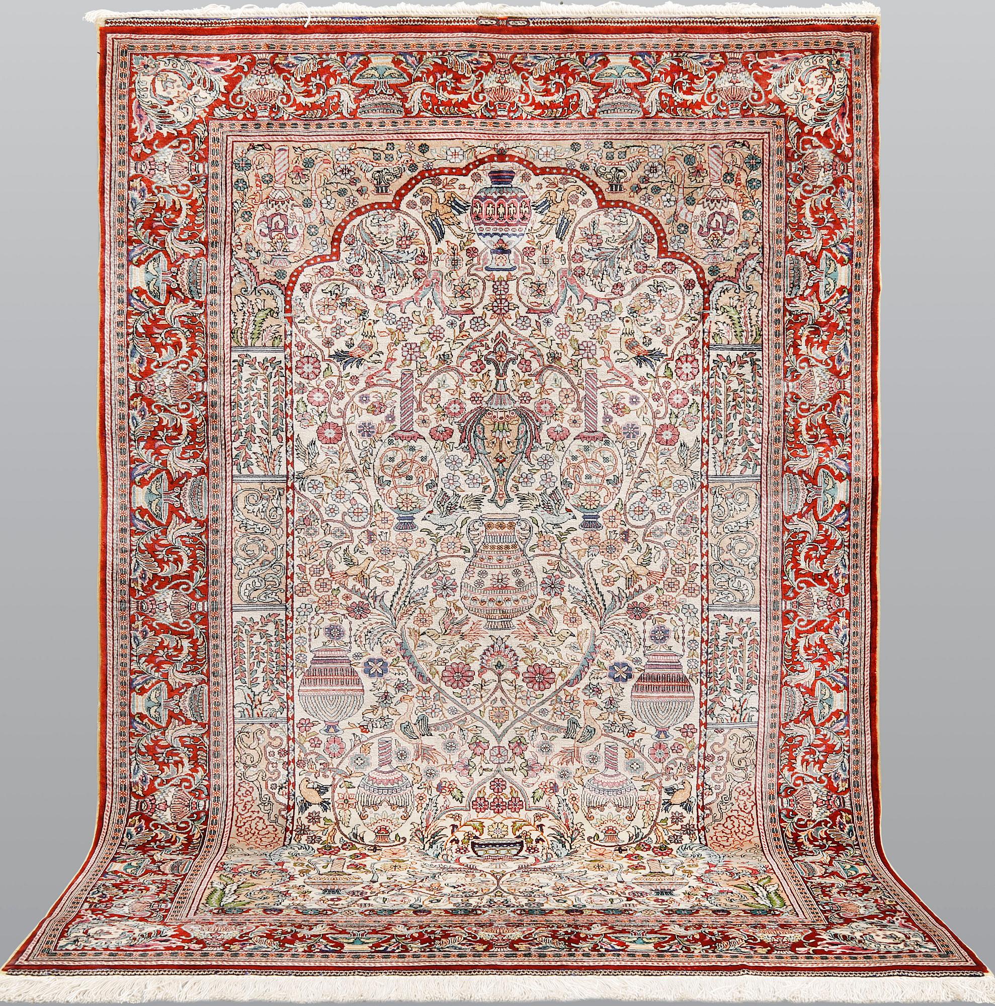 A oriental silk rug, 155 x 93 cm.