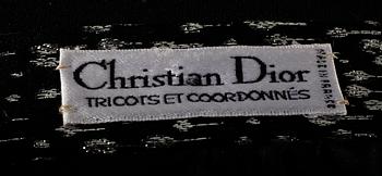 An ensemble consisting of skirt, top, belt and scarf by Christian Dior.