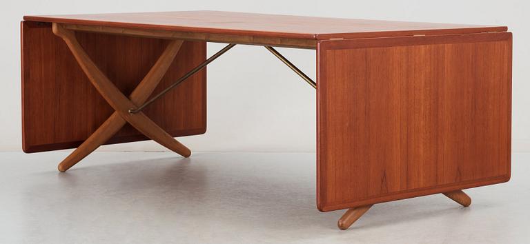 A Hans J Wegner teak and oak sabre leg dinner table by Andreas Tuck, Denmark 1950-60's.