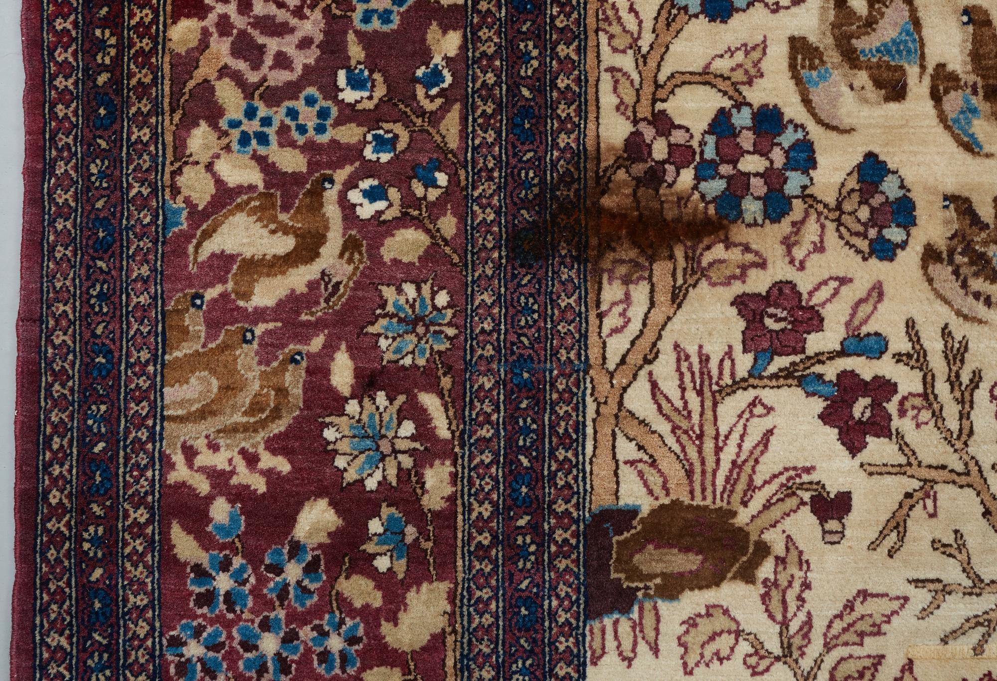 A RUG, a semi-antique Esfahan probably, figural, ca 214,5 x 137,5 cm.
