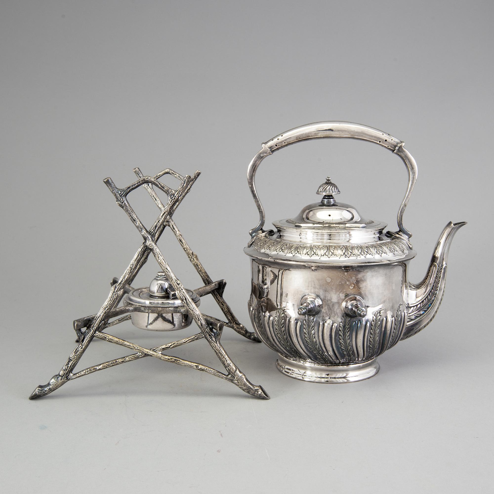 A 20th century tea pot on stand by Walker & Hall, Sheffield, England.