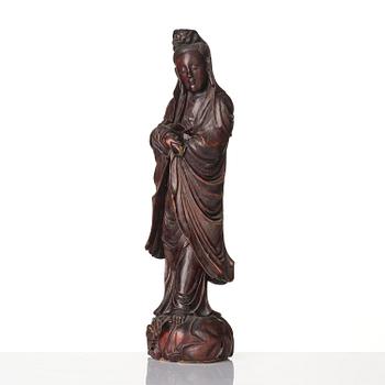 A wooden sculpture of Guanyin with metal inlay, Qing dynasty.