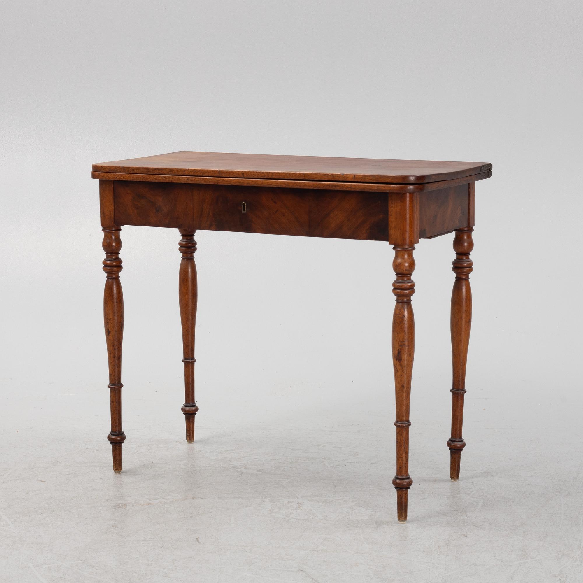 A mahogany games table, mid 19th Century.