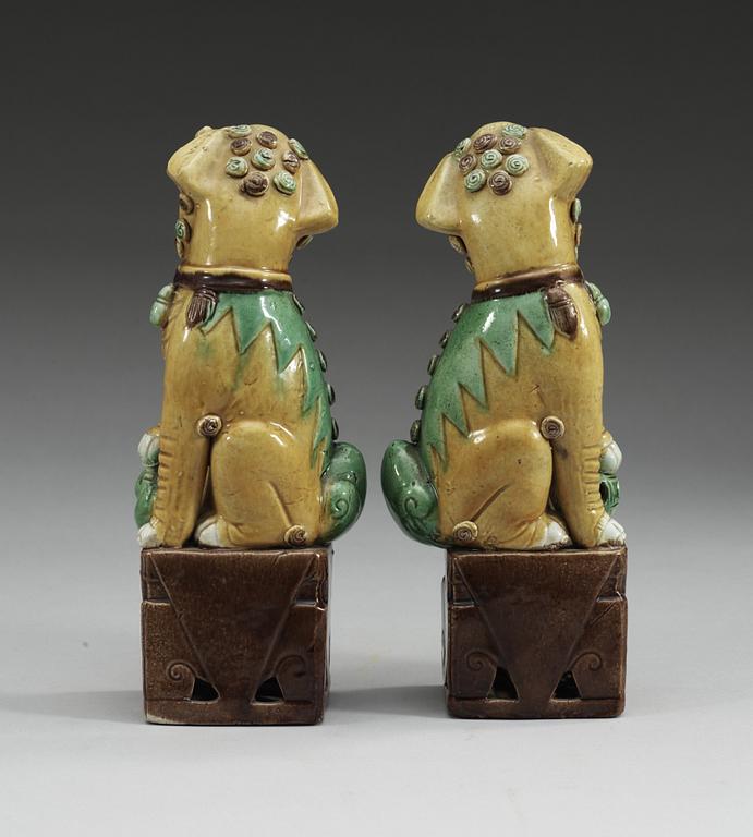 A pair of bisquit Buddhist lions, Qing dynasty, 19th century.