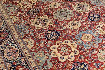 A Sarouk carpet, signed, approx. 327 x 253 cm.