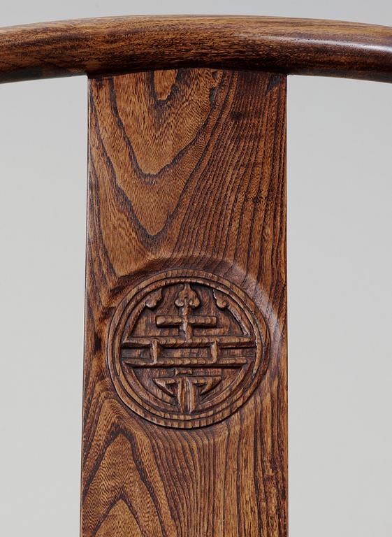 A pair of hardwood horseshoeback armchairs, Qing dynasty.