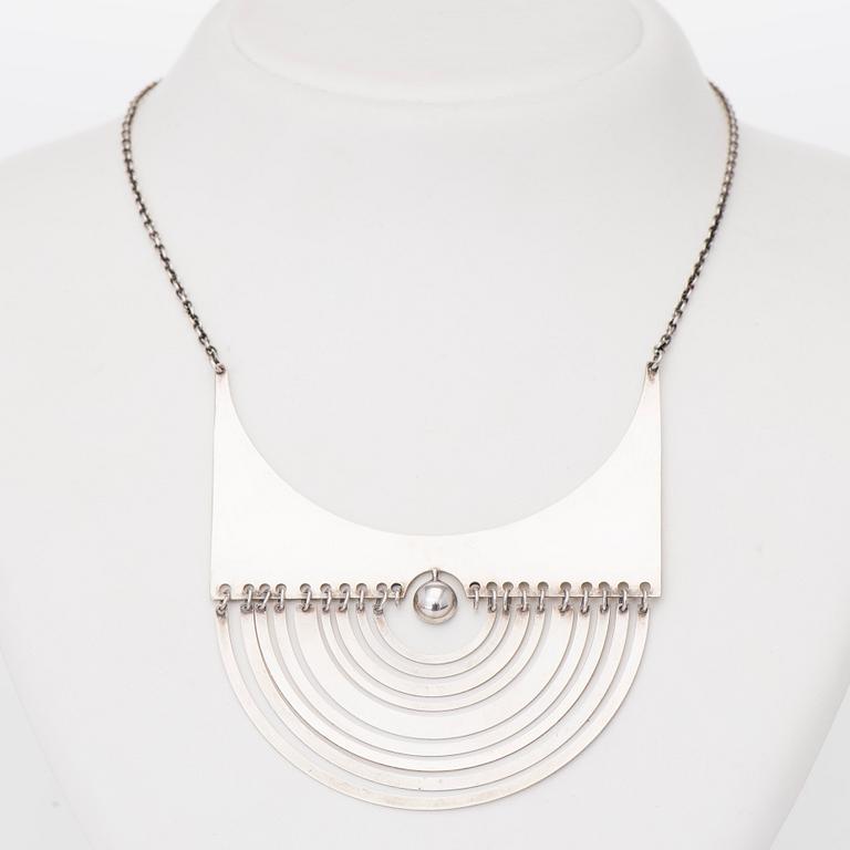 TAPIO WIRKKALA, A PENDANT, "Crescent", silver. Westerback 1973.
