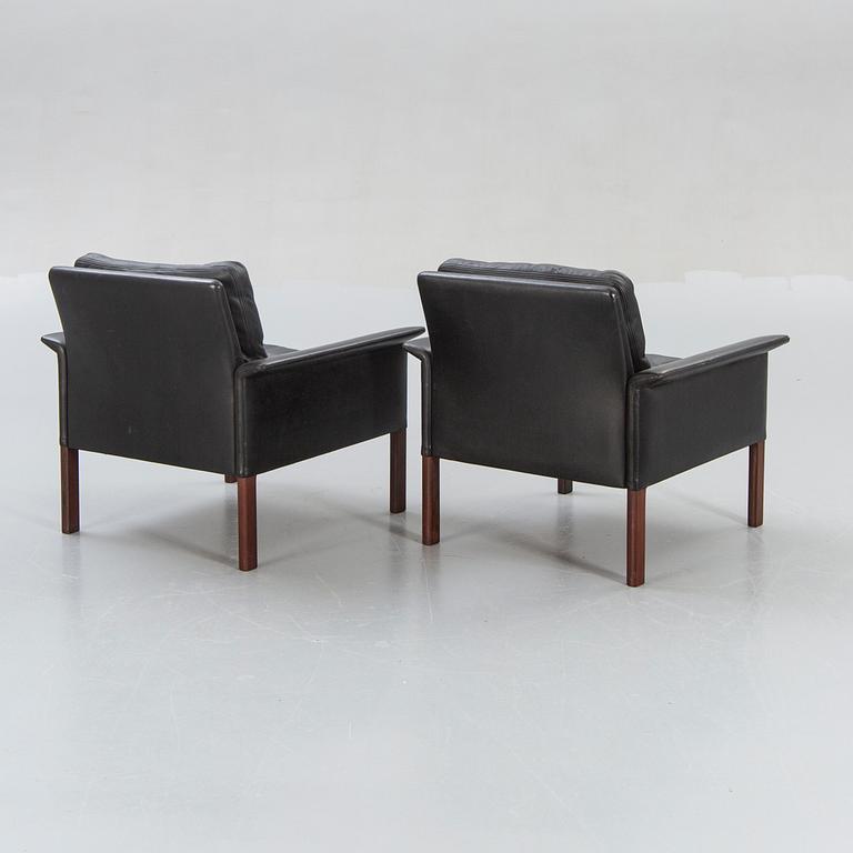 A pair of 1960s leather easy chairs.