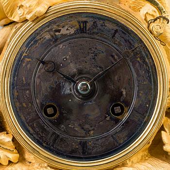 A French exoticism 1820/40's gilt bronze mantel clock.