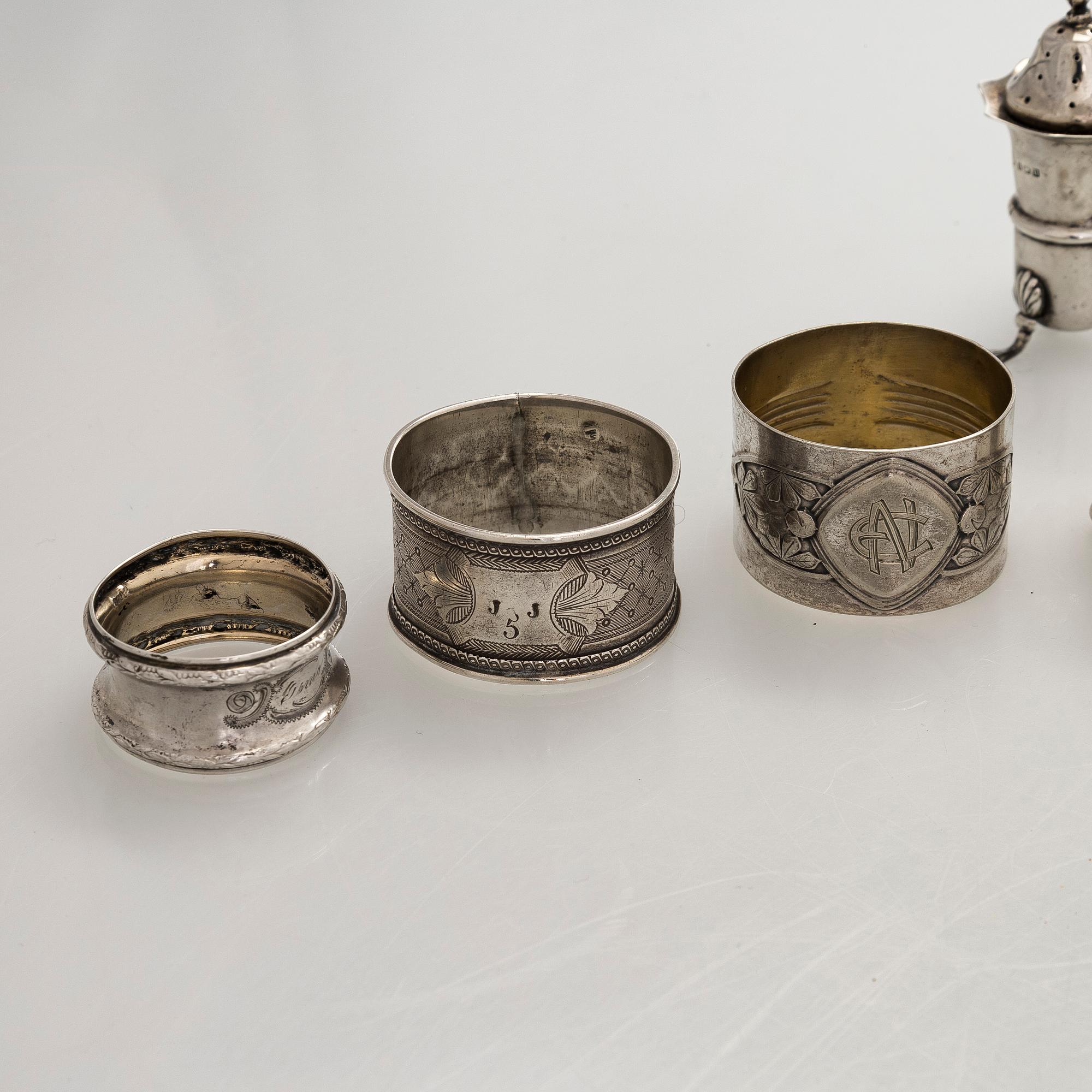 Napkin rings, 6 pcs, a pair of salt shakers, and salt cellars, silver and glass, including English and Finnish marks.