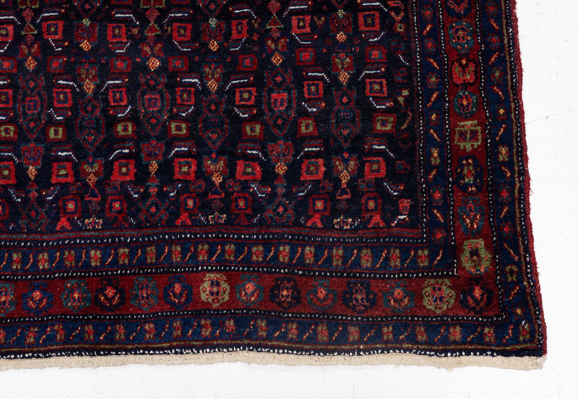 A semi-antique Bidjar carpet, c. 310 x 145 cm.