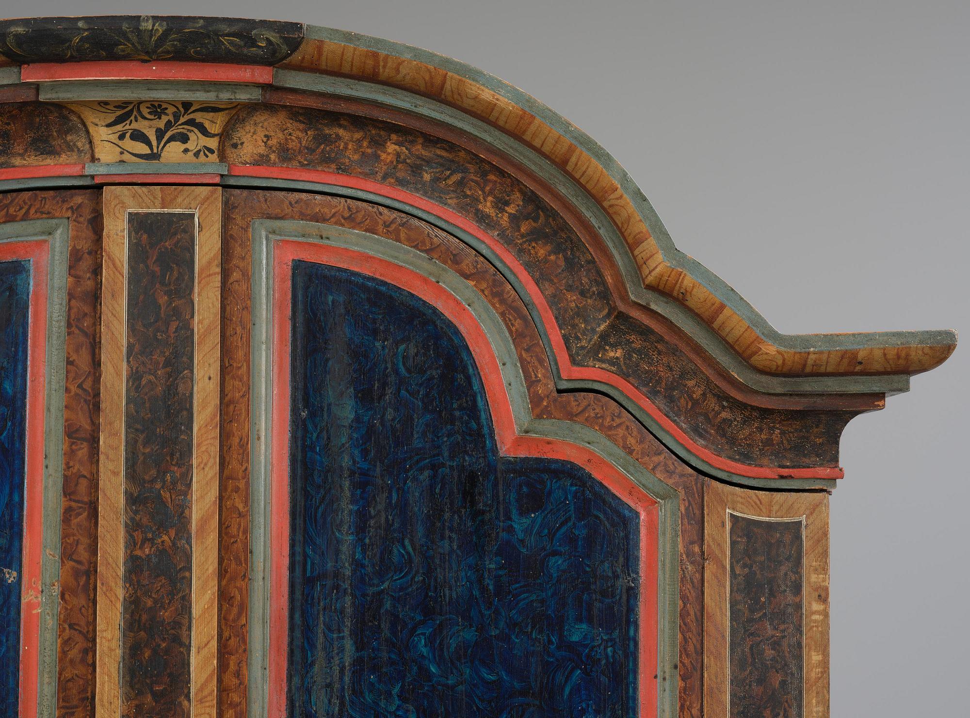 A polychrome-painted folk art cabinet from Värmland, Sweden, dated 1818.