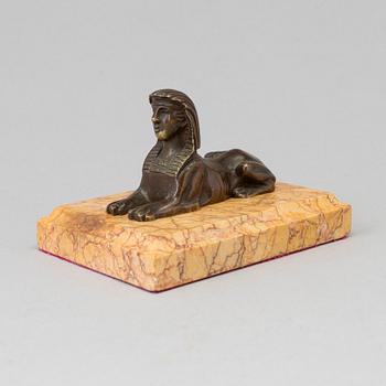AN EMPIRE  BRONZE AND MARBLE PAPER WEIGHT, early 19th century.