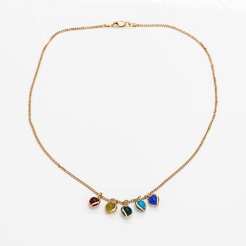 A 14K gold neckalce with glass pearls.