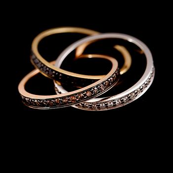 RING, tredelad, 18 k rött, vitt och roséguld, diamanter totalt 1.44 ct.