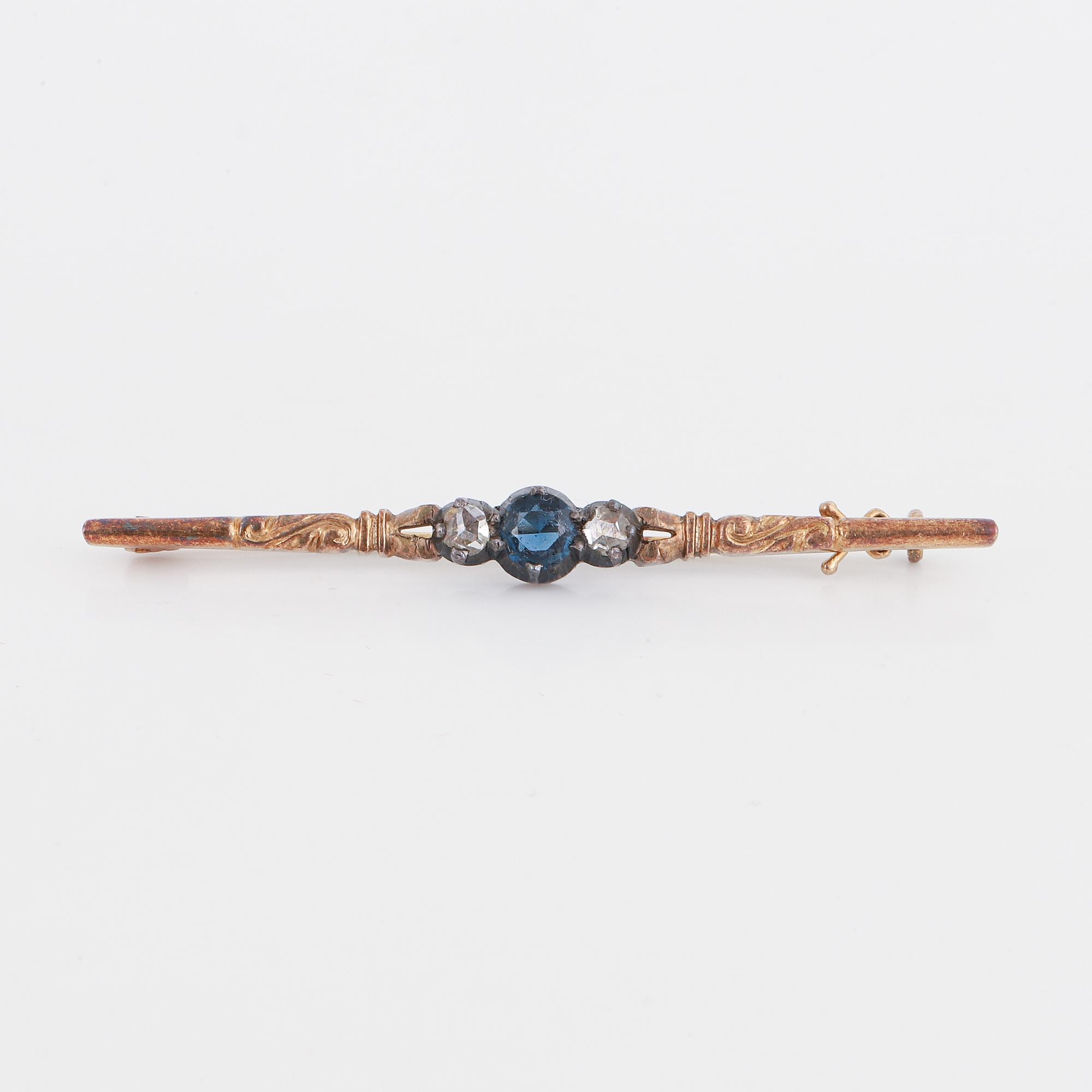 Synthetic blue stone and rose-cut diamond brooch.
