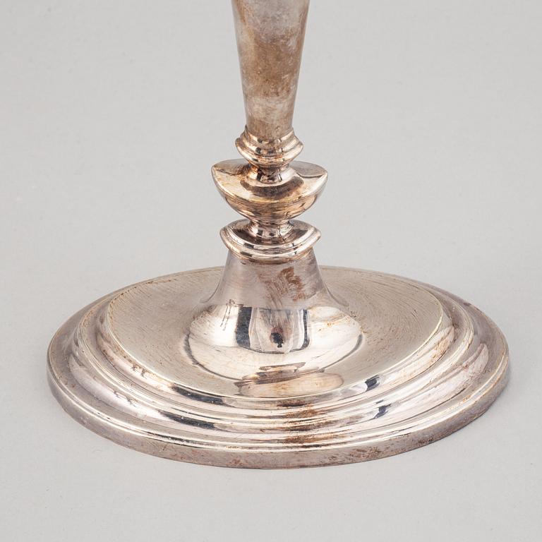 A set of four English 19th century silver-plated candlesticks.