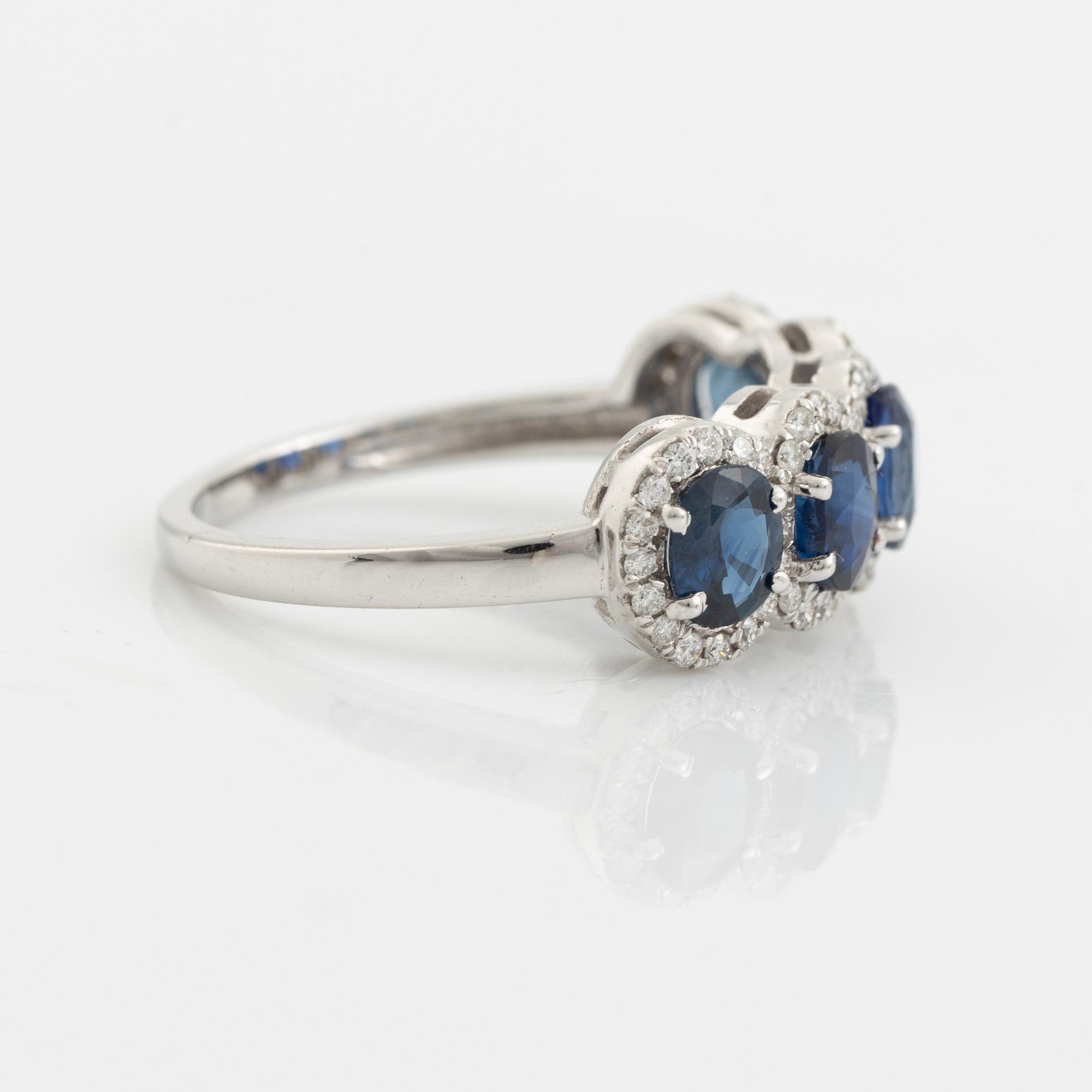 Oval sapphire and brilliant cut diamond ring.