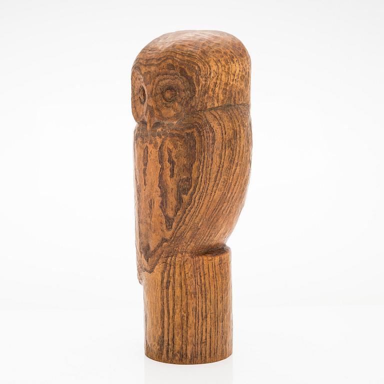 Gunnar Uotila, a wooden sculpture signed -56-.