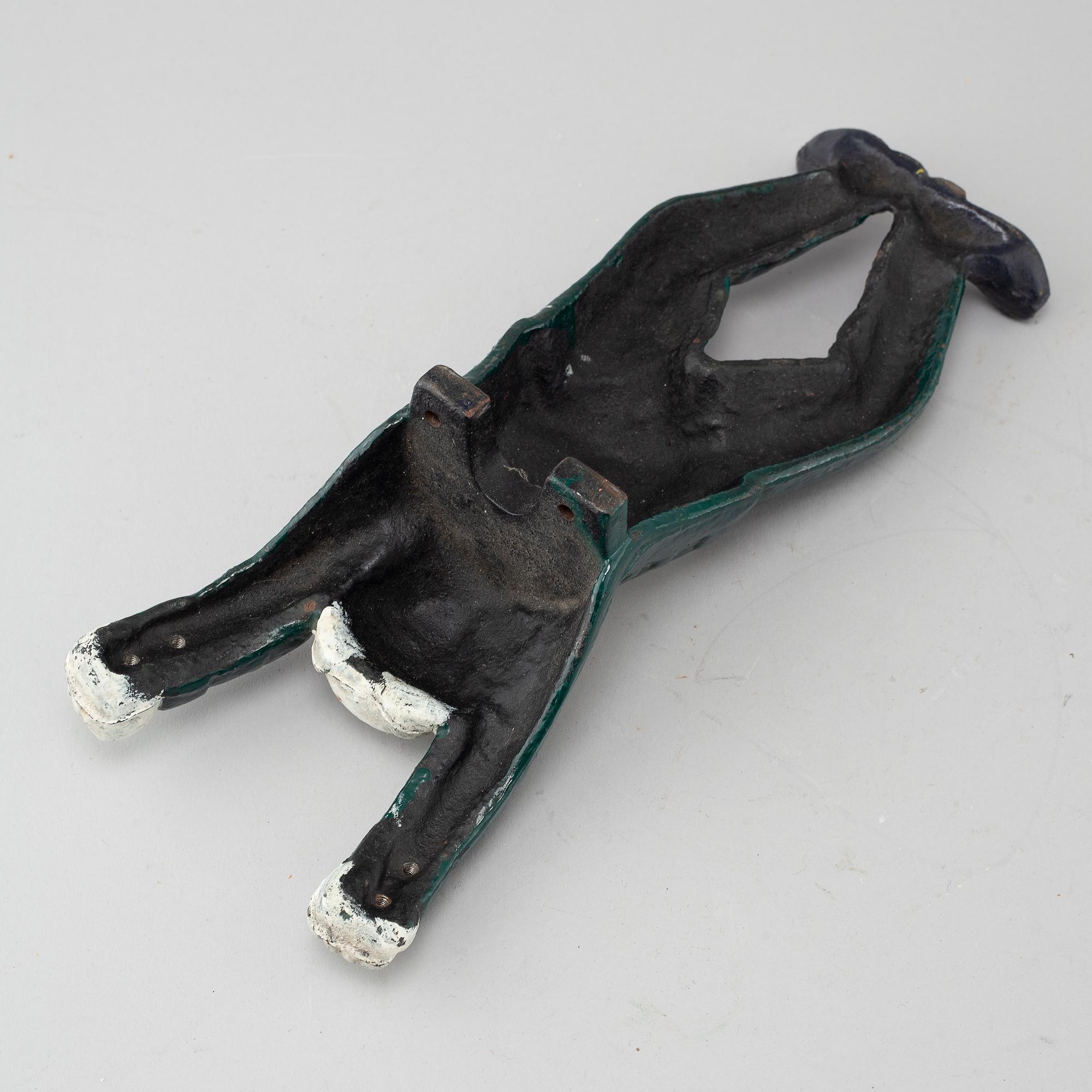 A 20th century cast iron boot jack.