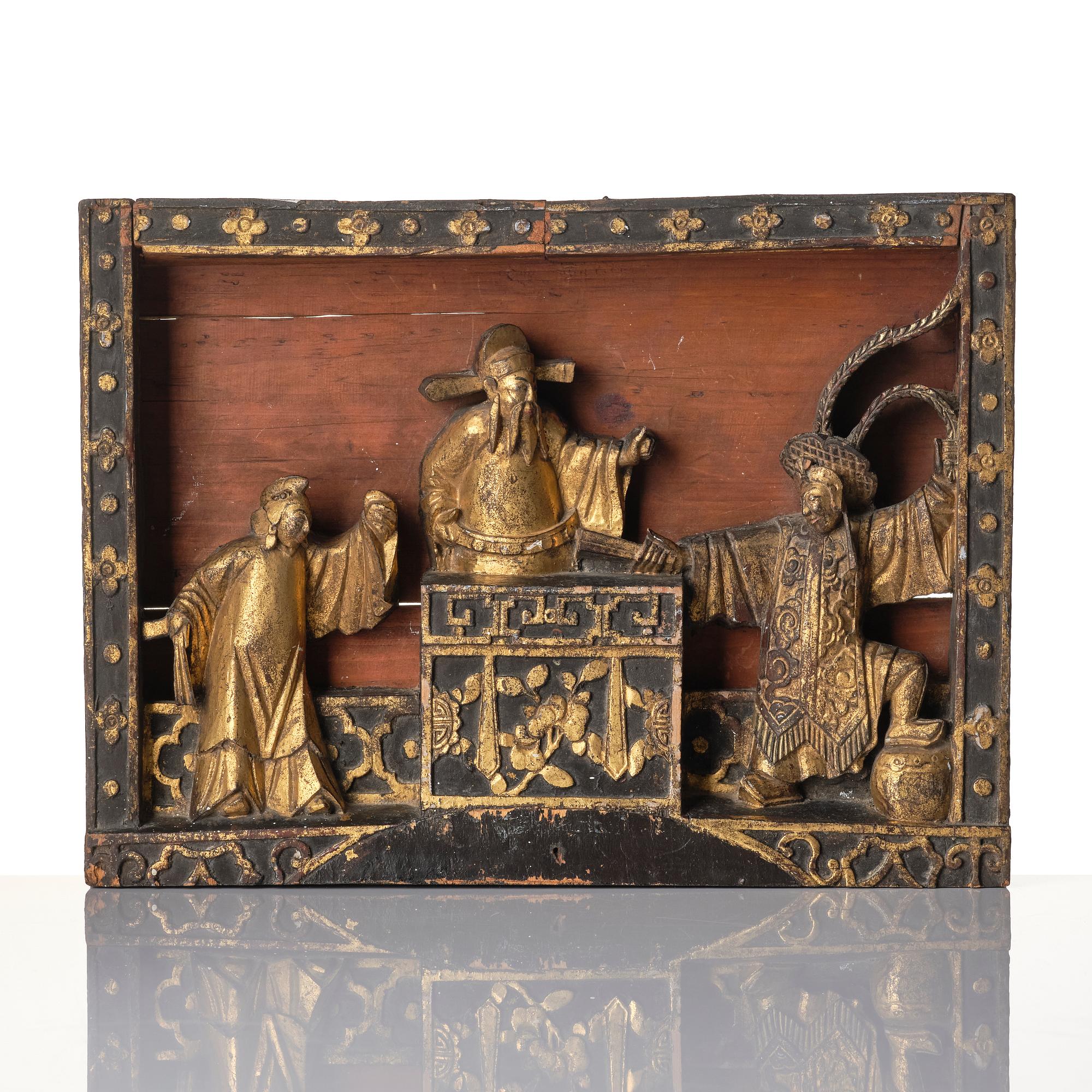 A Chinese wooden panel, Qing dynasty, 19th century.