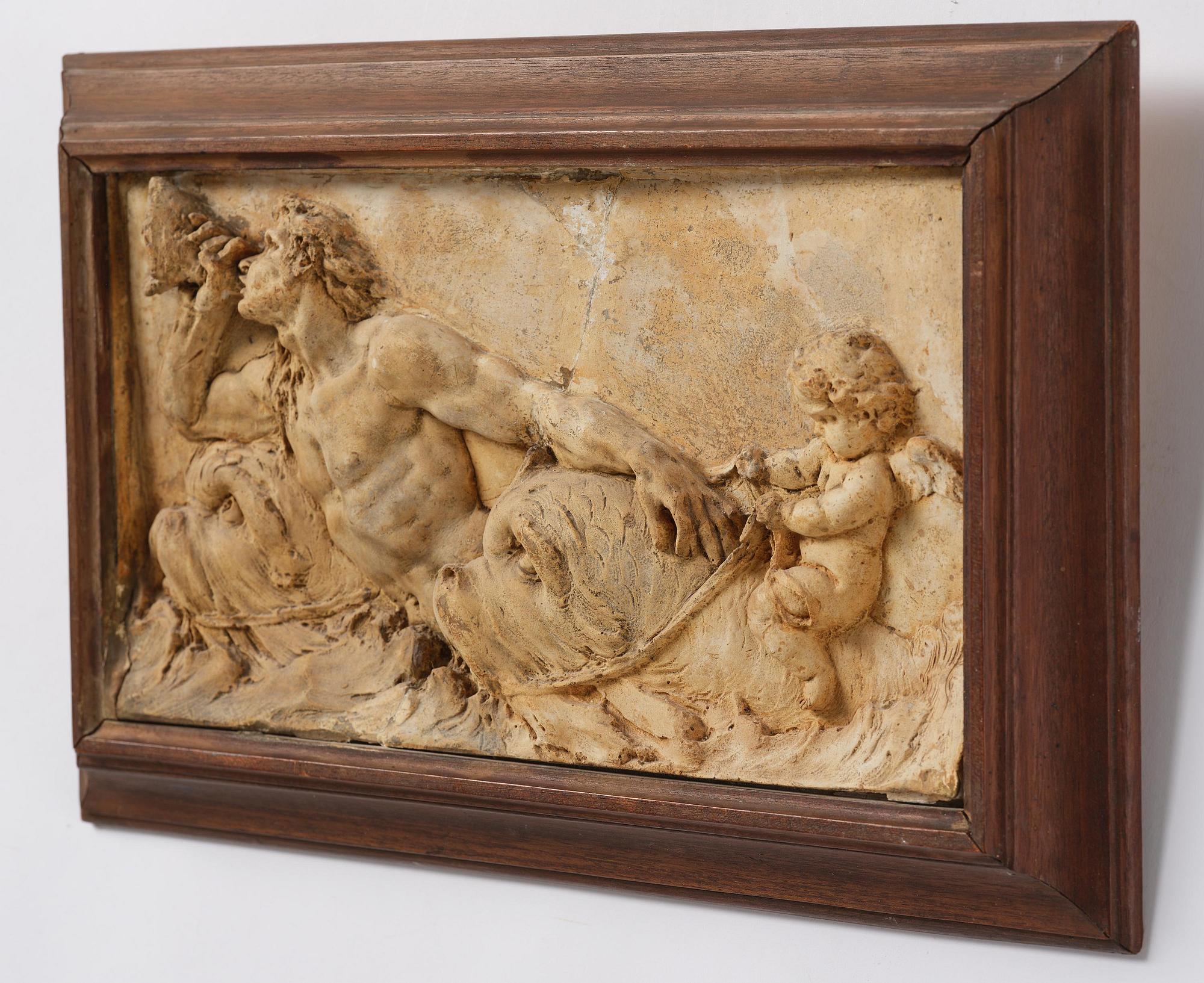 Claude Michel Clodion, attributed to, A relief depicting a nereid riding a dolphin alongside a triton blowing into a conch.