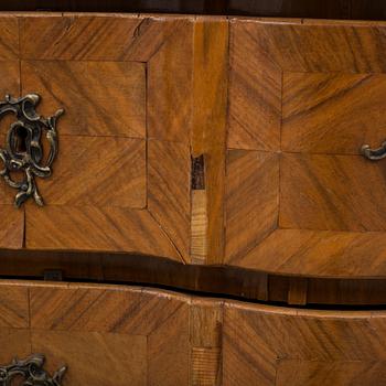 A baroque style chest of drawers circa 1900.