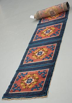 A MEDITATION CARPET, ten squares, a semi-antique Ningxia, China, ca 598,5 x 62 cm.