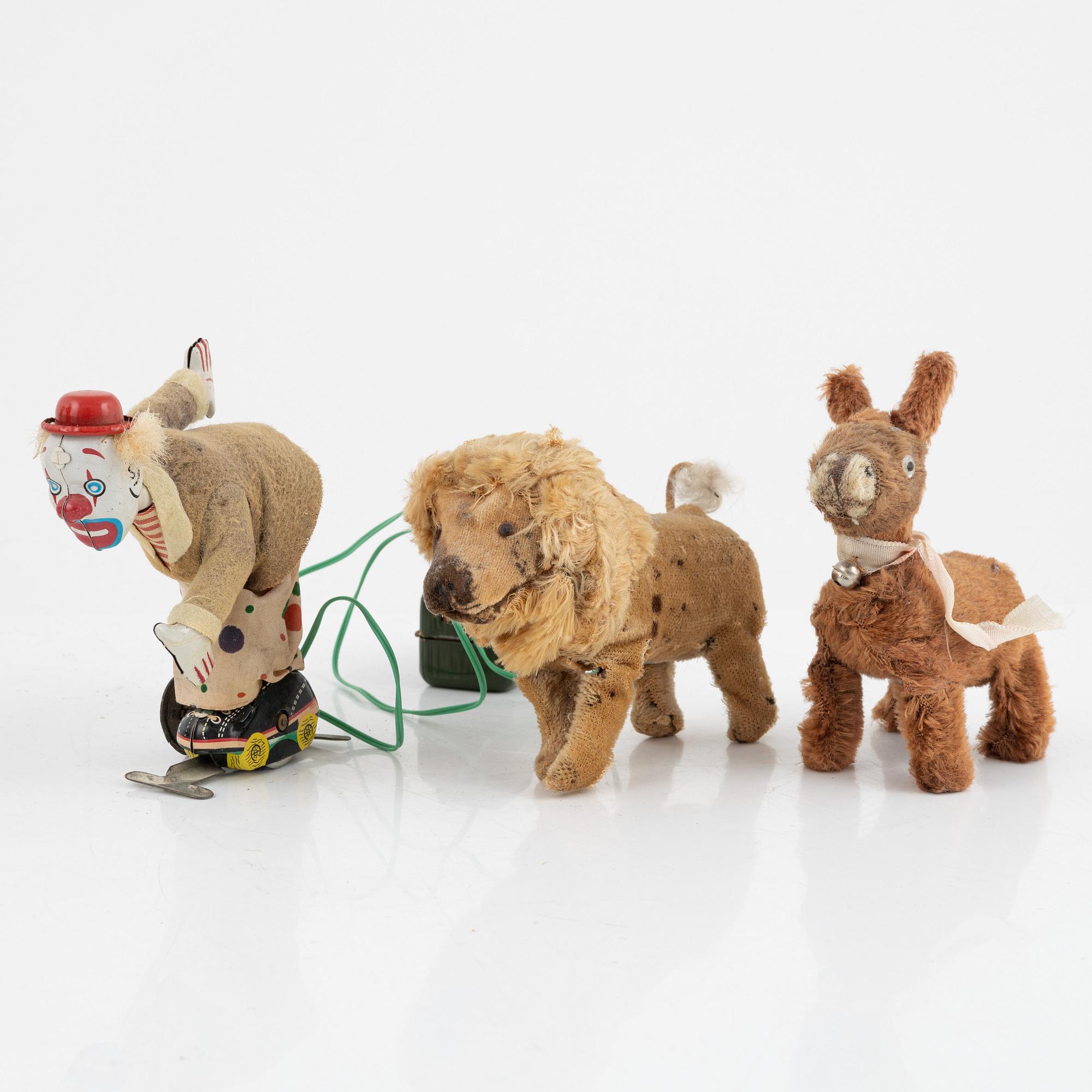 A set of five toys, including 'Rolly' clown from Schuco, 20th century.