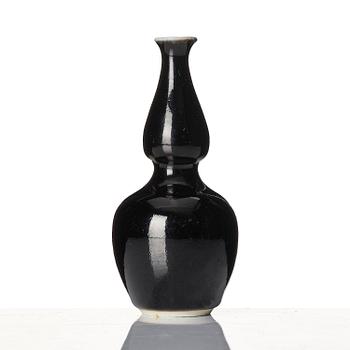 A calebass shaped black glazed vase, Qing dynasty, 19th century.