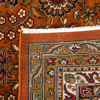 An old Kirman carpet ca 408 x303 cm.