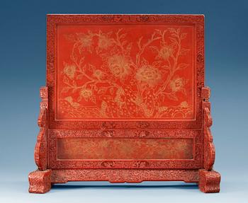 A red lacquer screen and stand, Qing dynasty, 18th Century.