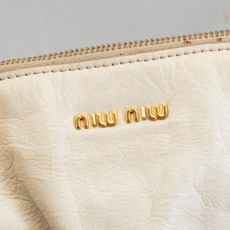 A bag by Miu Miu.