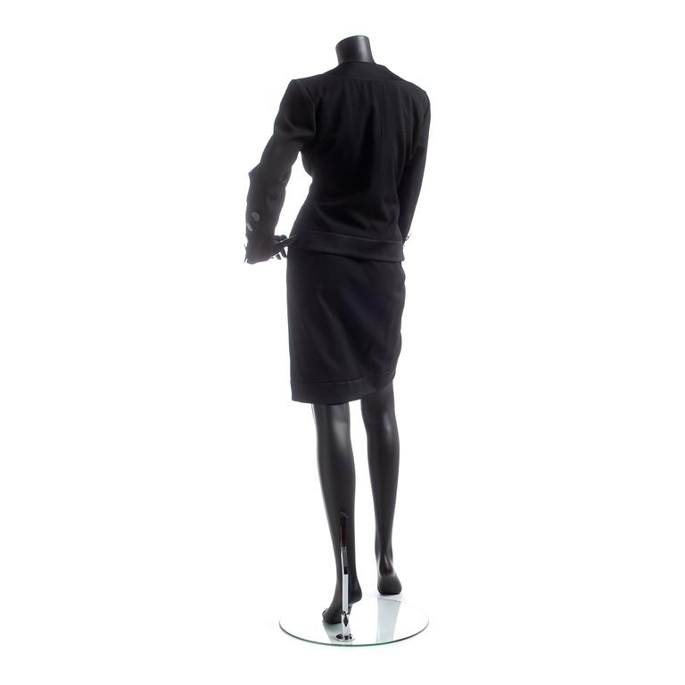 YVES SAINT LAURENT, a black wool dress.
