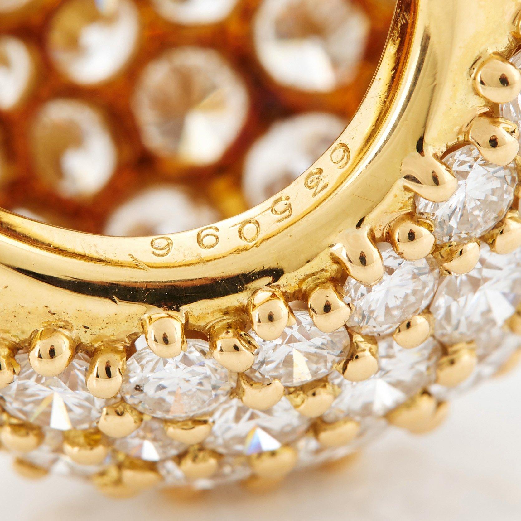 Cartier "Marrakech" an 18K gold bombé ring set with round brilliant-cut diamonds.