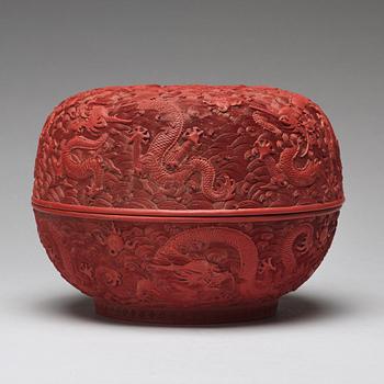 A carved red dragon box with cover, Qing dynasty (1662-1912).