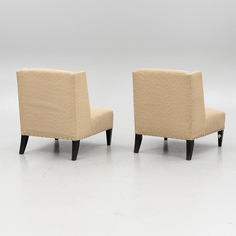 A pair of 'Triton custom chair' lounge chairs, Andrew & Martin, England, 21st century.