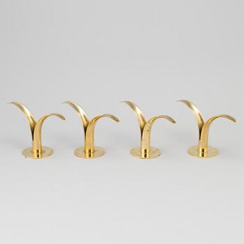 Two pair of 'Liljan' brass candlesticks by Ivar Ålenius-Björk, Ystad Metall, second part of the 20th century.