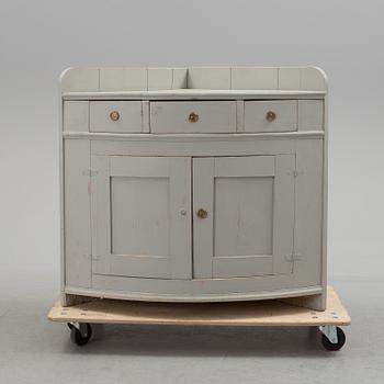 A mid 19th century corner sideboard.