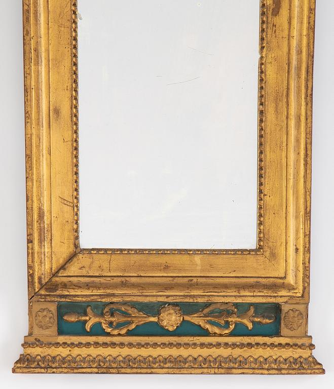 An Empire mirror, first half of the 19th century.