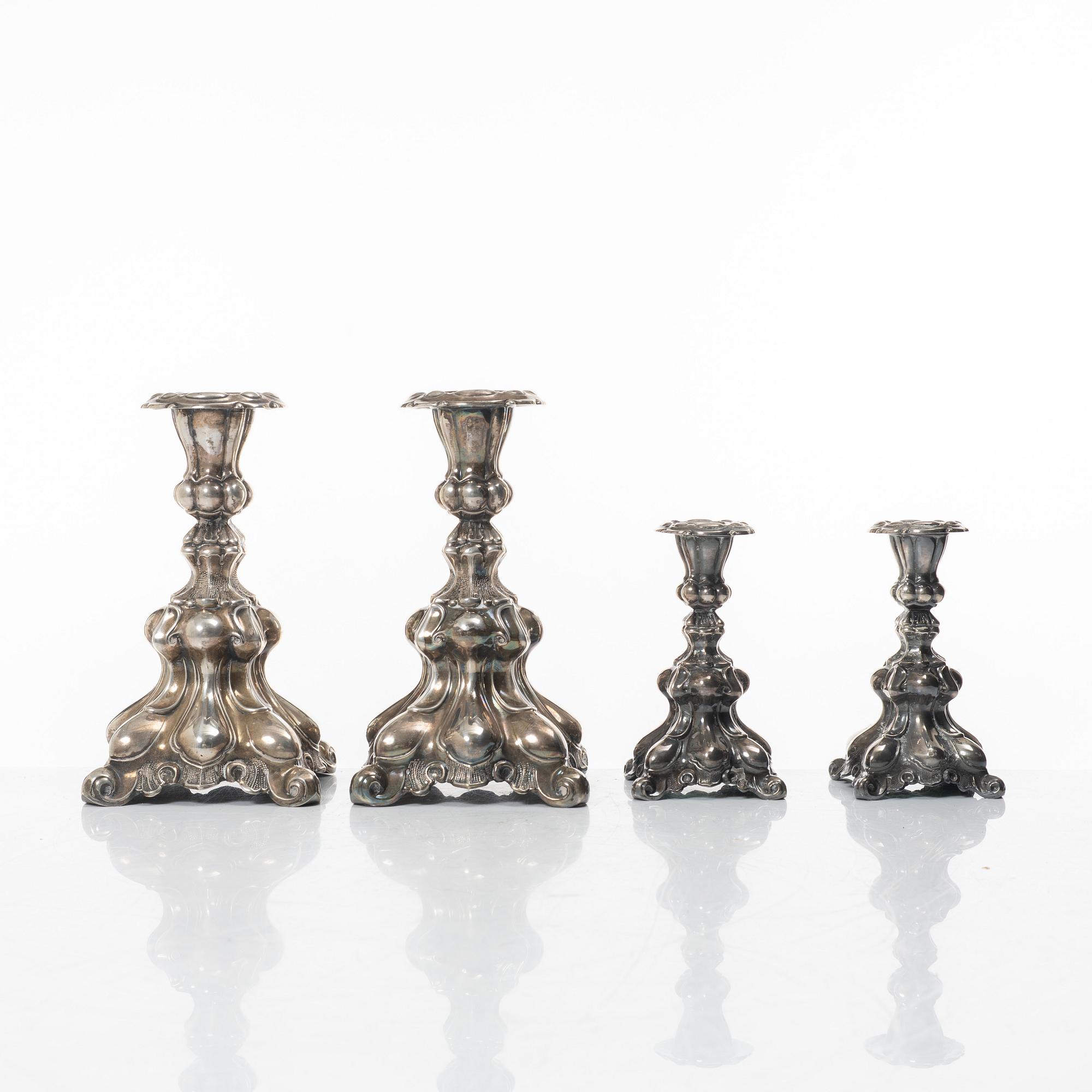 Four Baroque style silver candlesticks, 20th century.