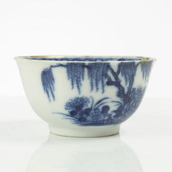 A Chinese soft paste cup with saucer, Qing dynasty, 18th century.