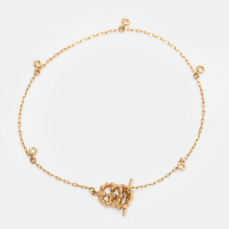 Gucci, armband, "Interlocking", 18K guld med briljantslipade diamanter.