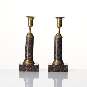 A pair of late Gustavian gilt-brass and 'Blyberg' porphyry candlesticks, Stockholm, circa 1800.